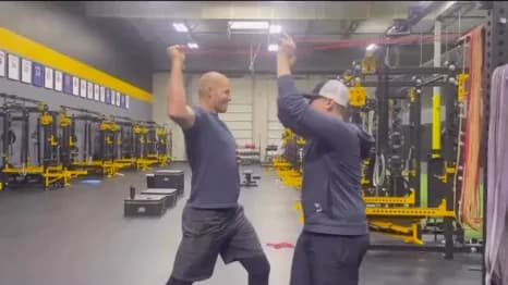 Professional pitcher training the shoulder through an overhead rehab drill
