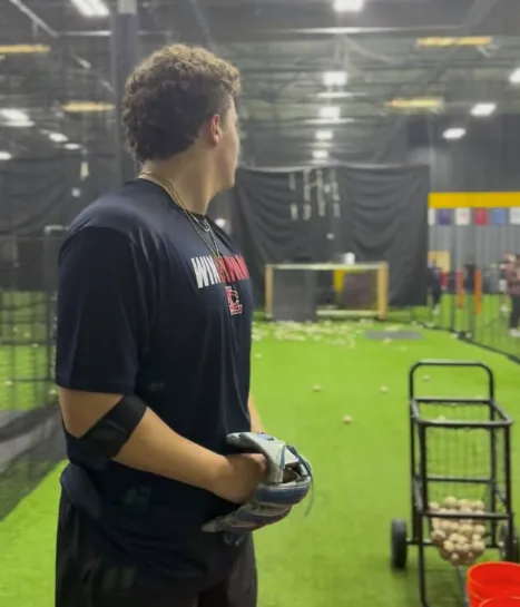 Baseball athlete progressing through monitored mound work after Tommy John surgery