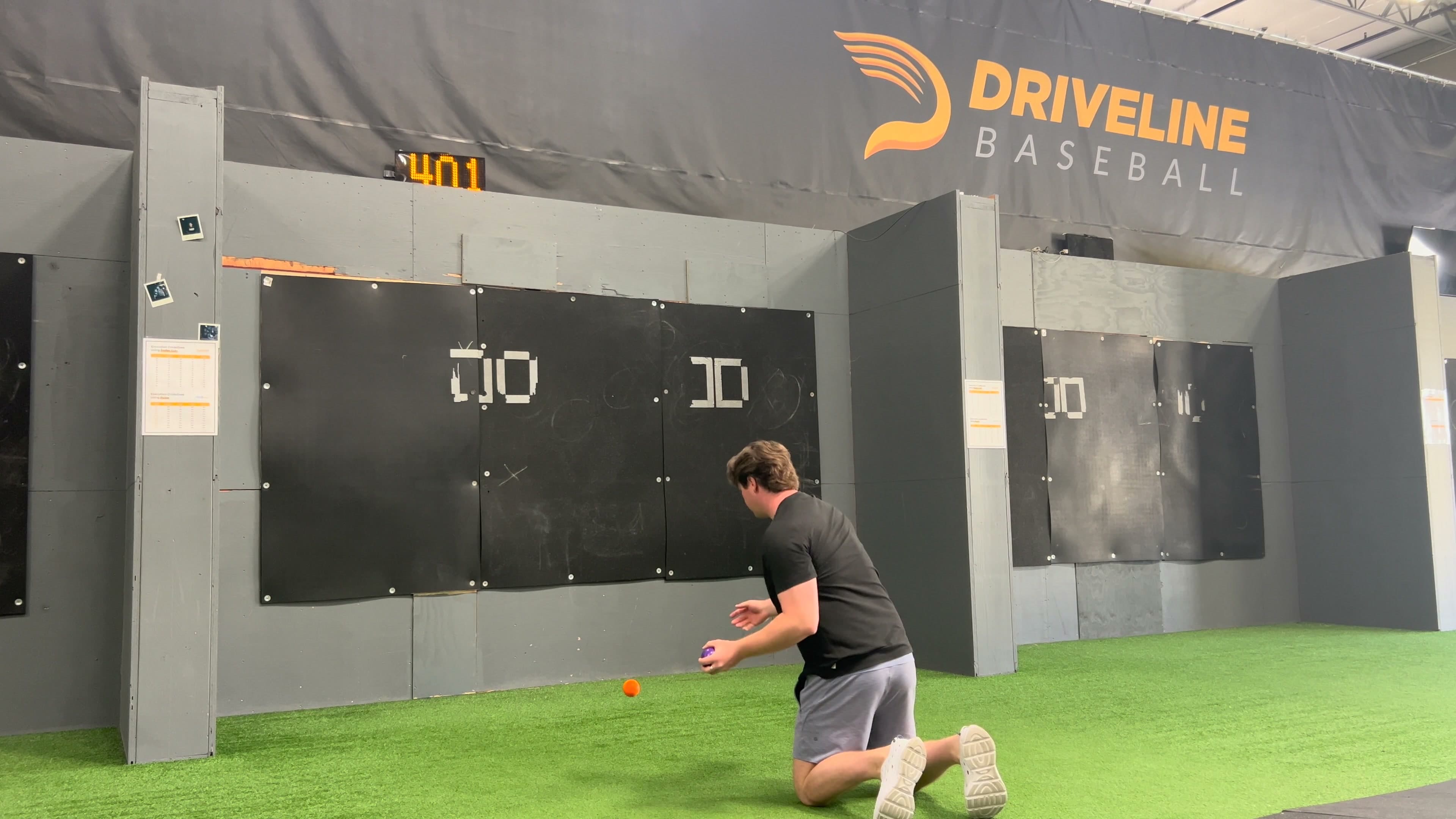 Baseball player performing a tall-kneeling plyometric arm drill before returning to throwing