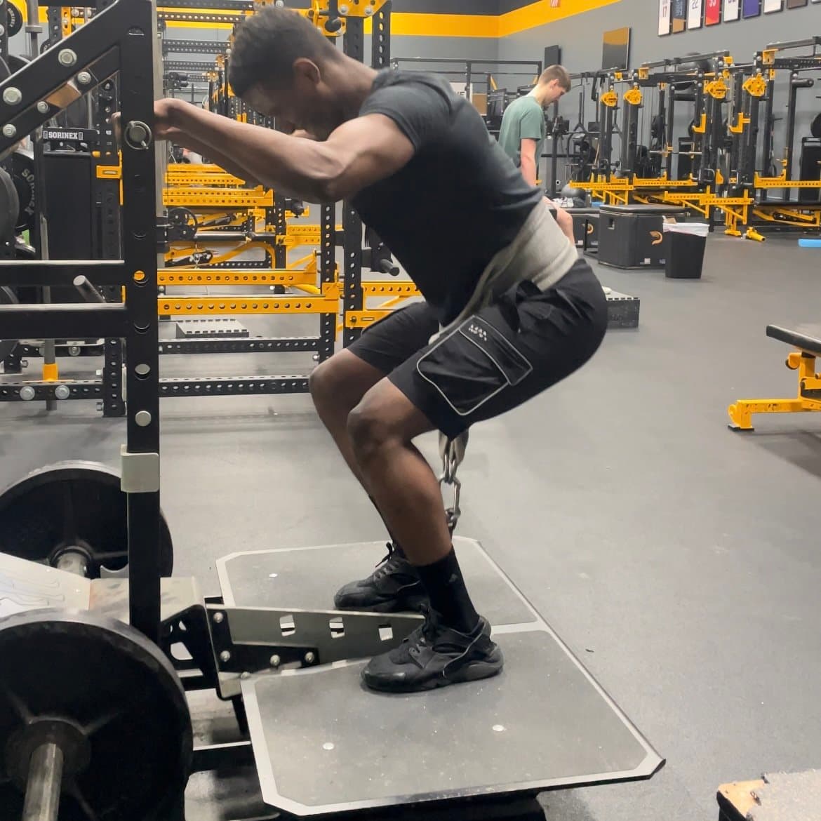 Athlete performing weighted squat
