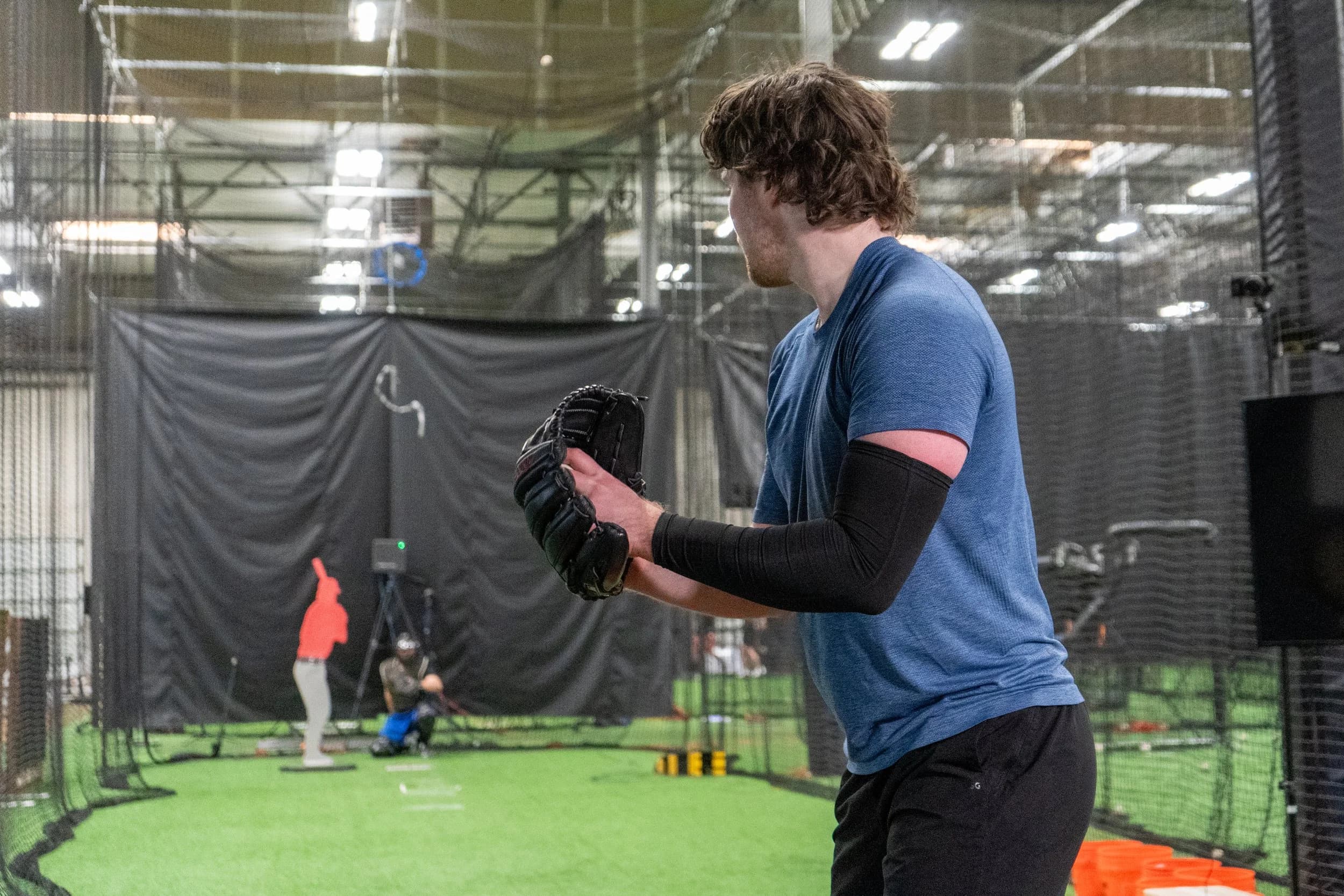 Athlete throwing in Driveline Baseball facility during return-to-throw program
